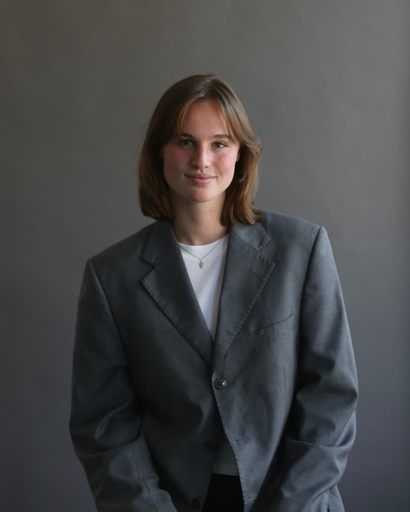 Model wearing women's black cotton crewneck tee.