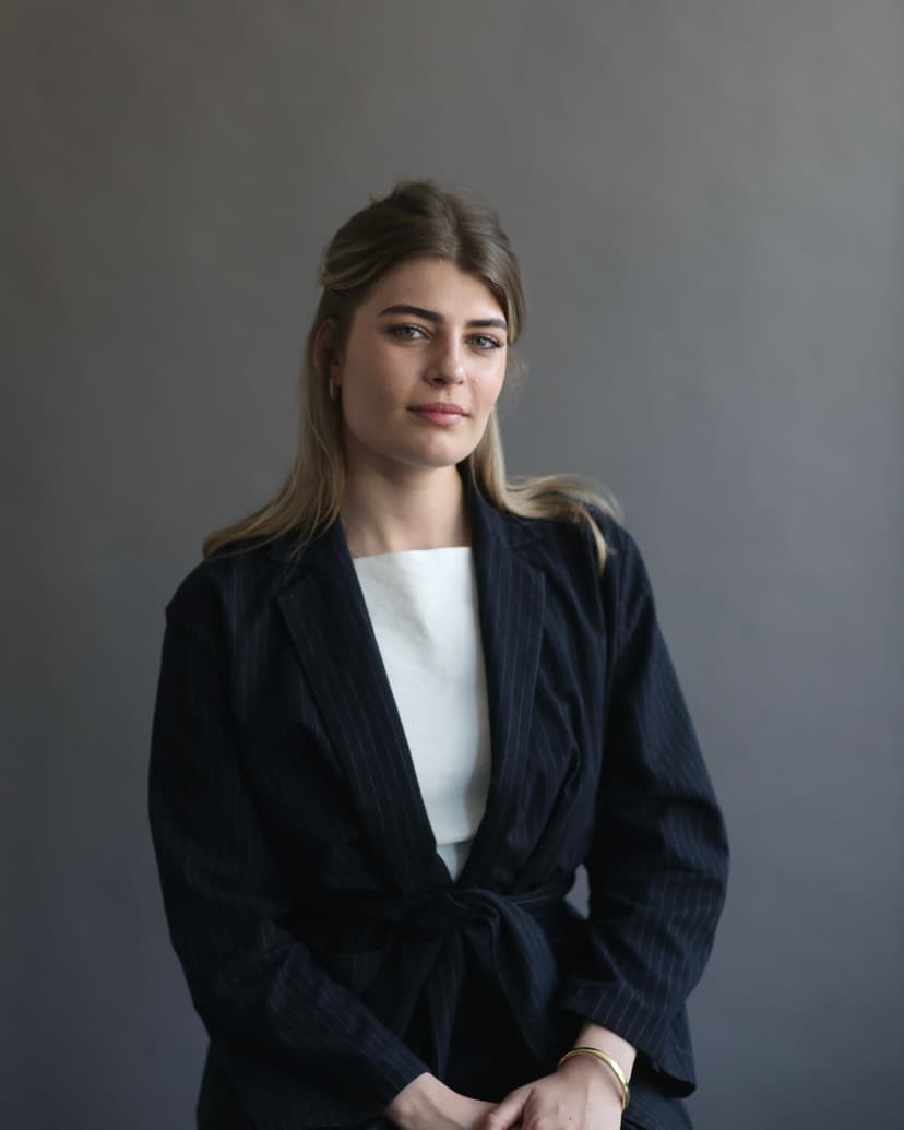 Model wearing women's black cotton crewneck tee.